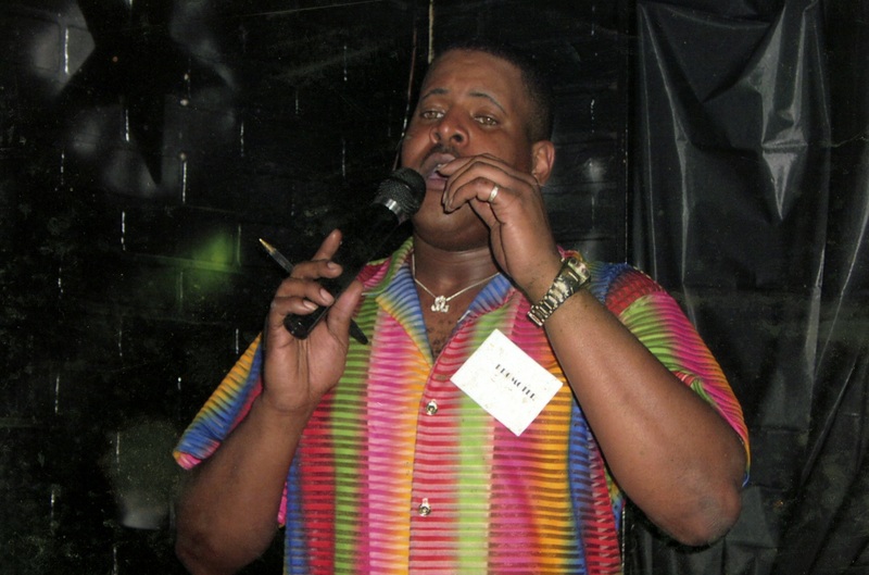Gary Carrington speaks into a mic.
