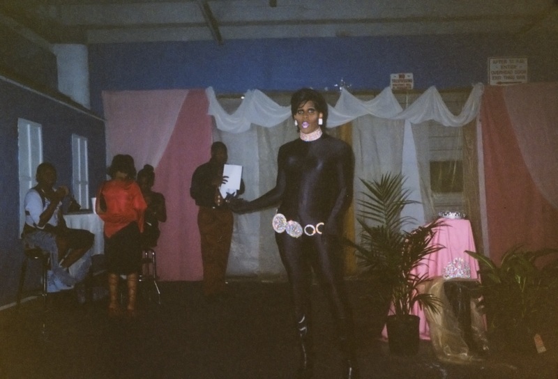 Feminine entertainer poses in parking garage at Soakie's.