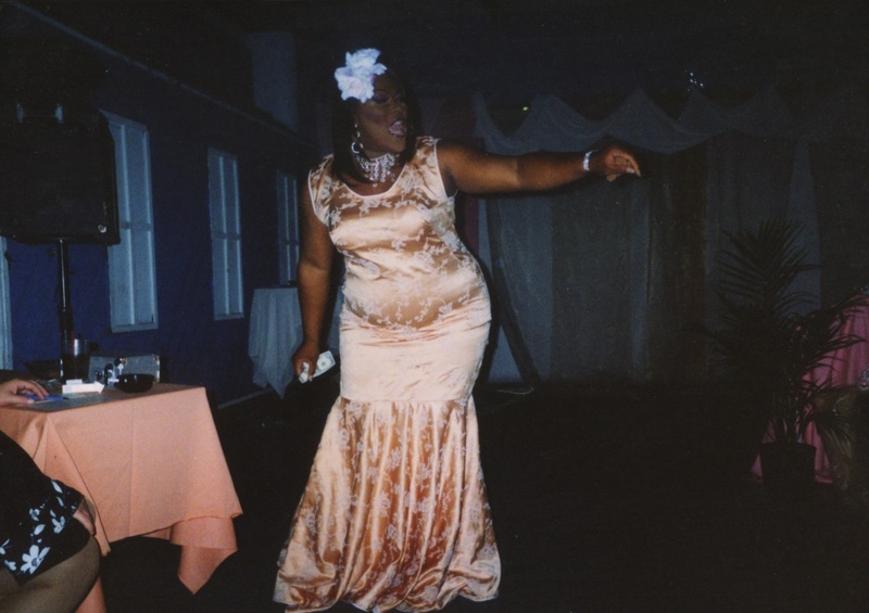 An entertainer at Soakie's points toward the crowd during their performance.