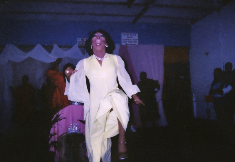 A feminine performer at Soakie's entertains the crowd.