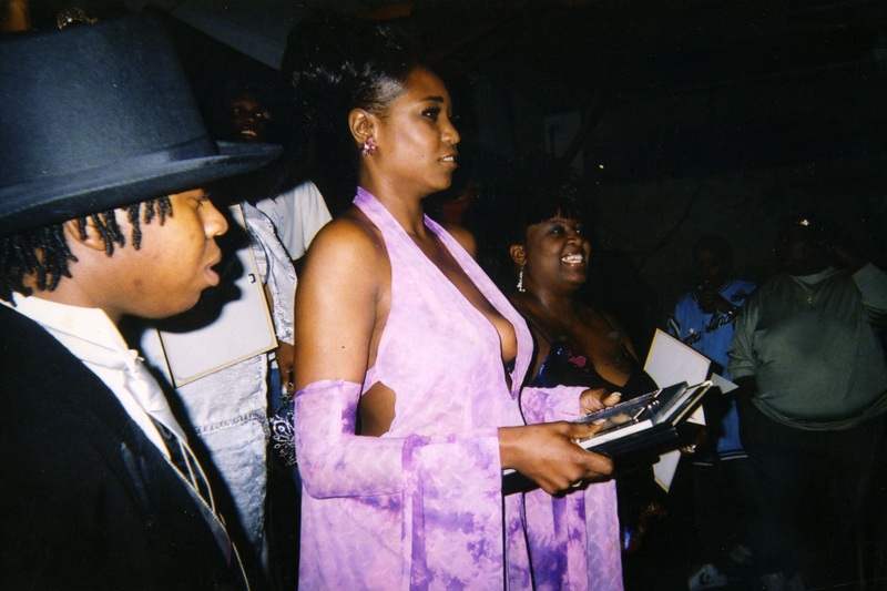 A performer at Soakie's receives a pageant award.
