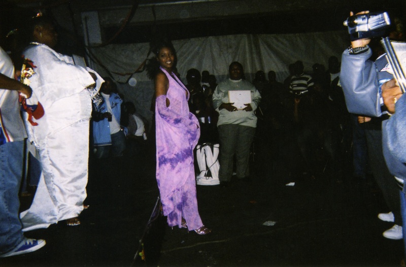 A performer at Soakie's looks over their right shoulder to the camera.